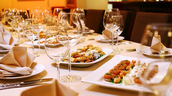 Closeup shot of an Indian tasty food called "Marwari Veg Thali" on the wooden table